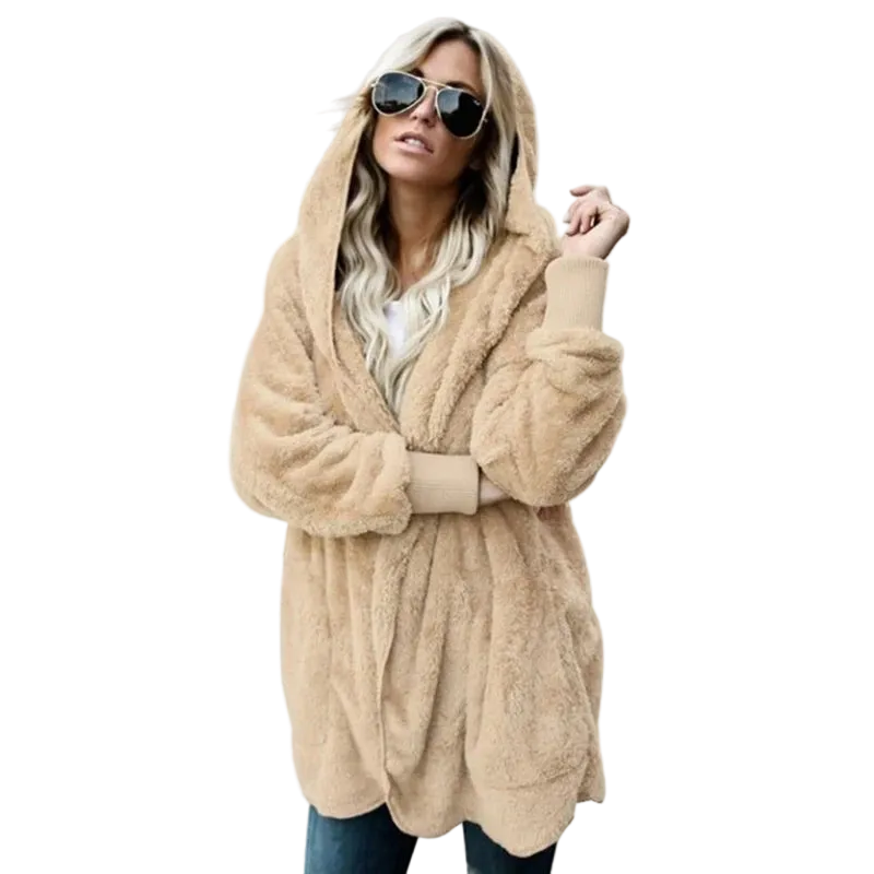 Woman wearing a beige fluffy hooded coat on a white background