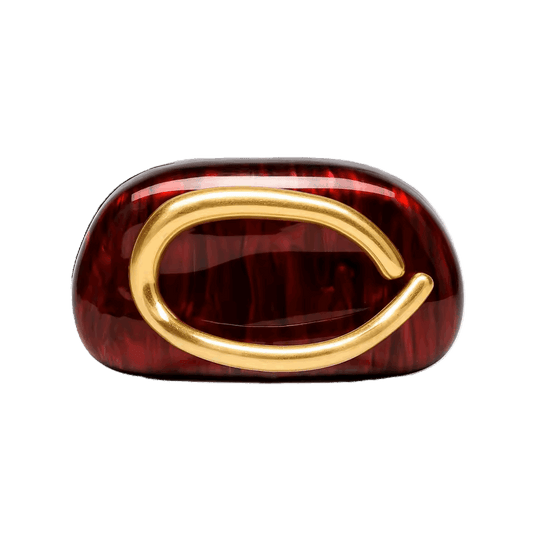 Red ring with gold design on a white background