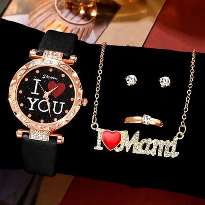 Jewelry set with watch, necklace, ring, and earrings on a black surface.