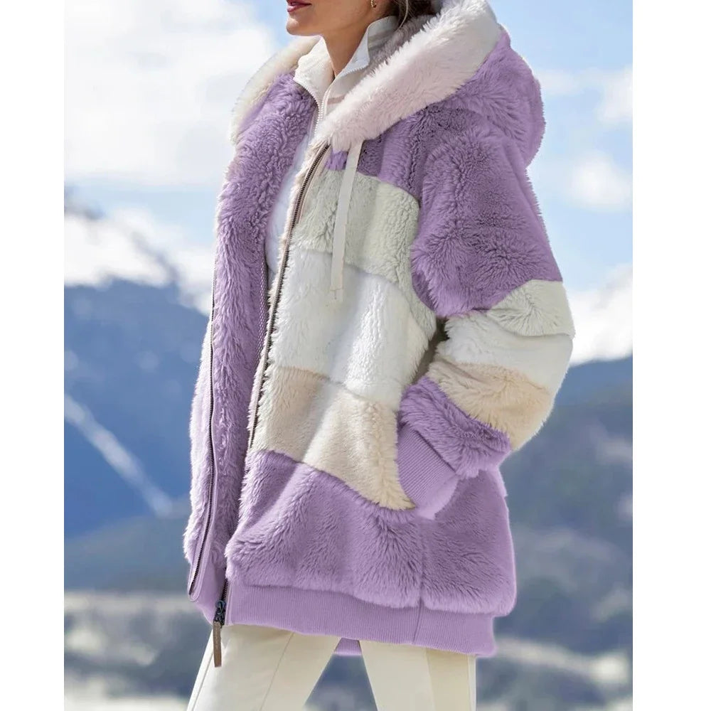 Person wearing a purple and white sherpa jacket 