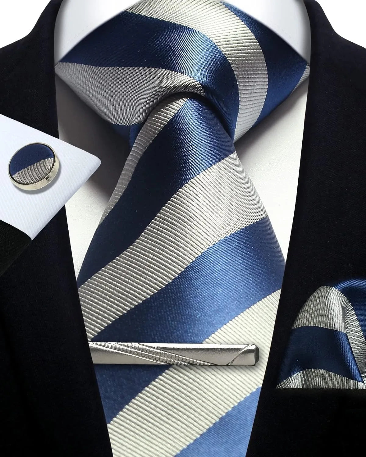 Navy and gray striped tie with matching pocket square and cufflinks on a black suit.